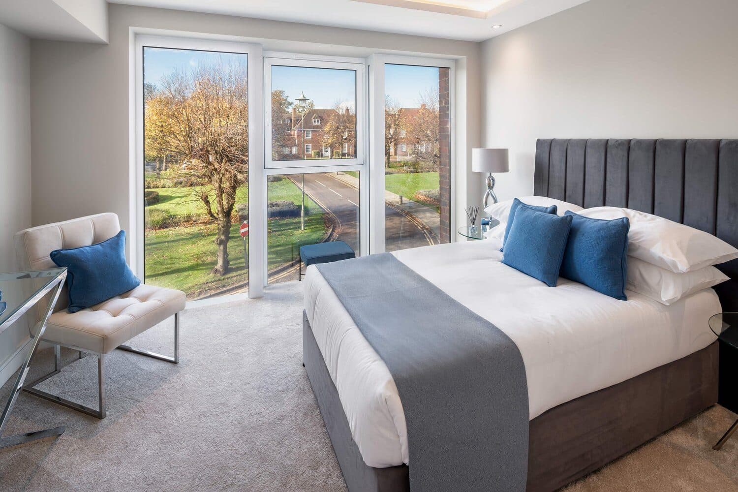 A bedroom looking out over a green, photographed by Biztour