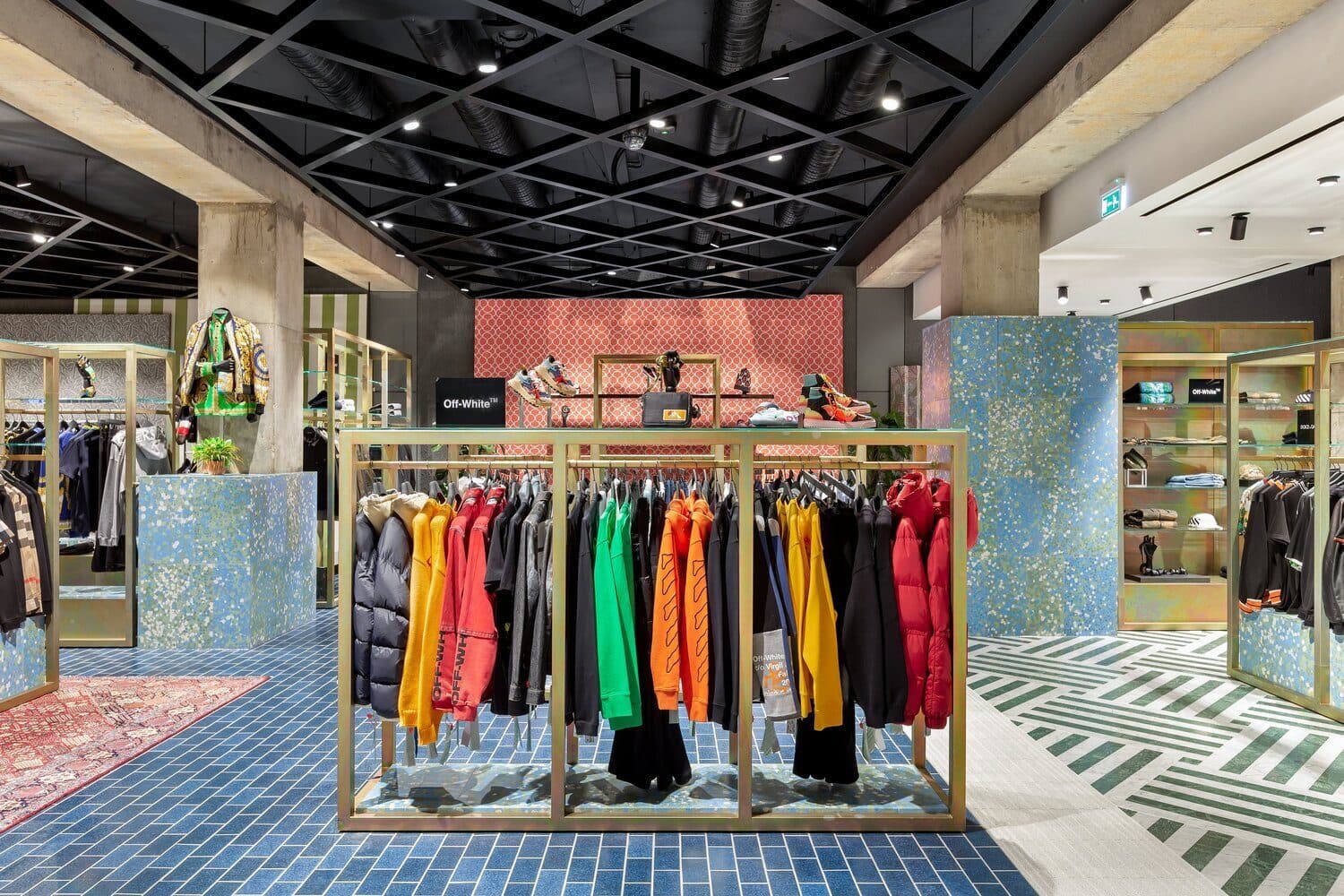 A designer concession on the shop floor at Flannels, shot by Biztour