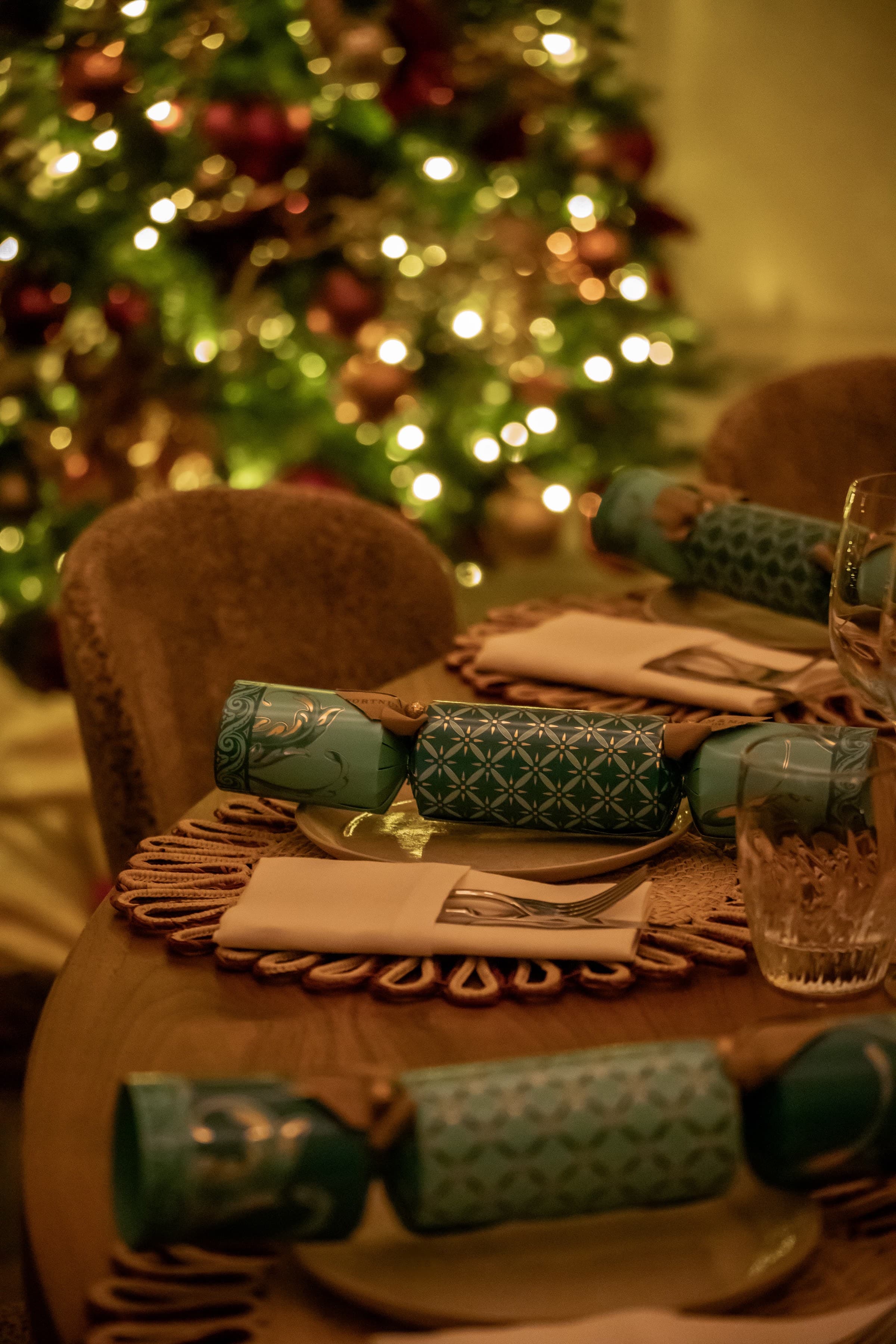 A Christmas table setting styled for a seasonal shoot, photographed by Biztour