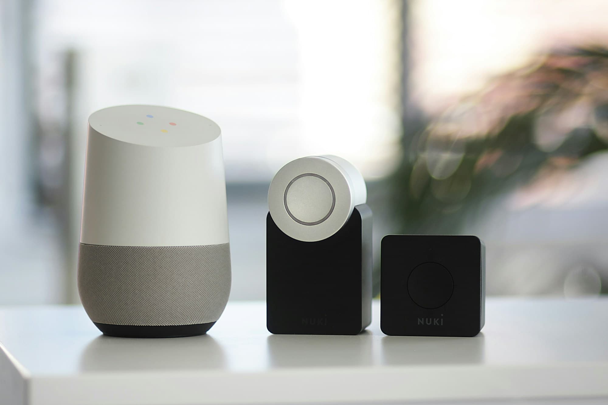 A smart speaker and smart lock devices on a shelf